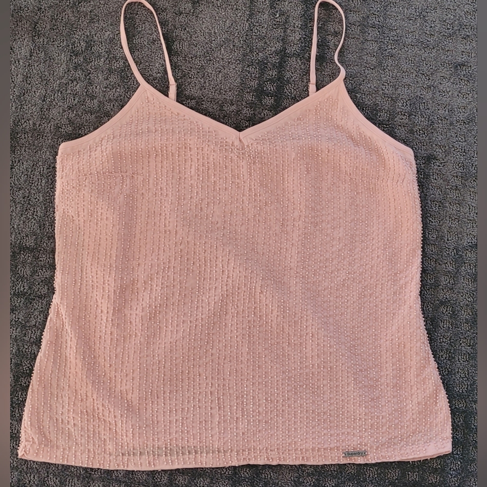 Pink top with beads.